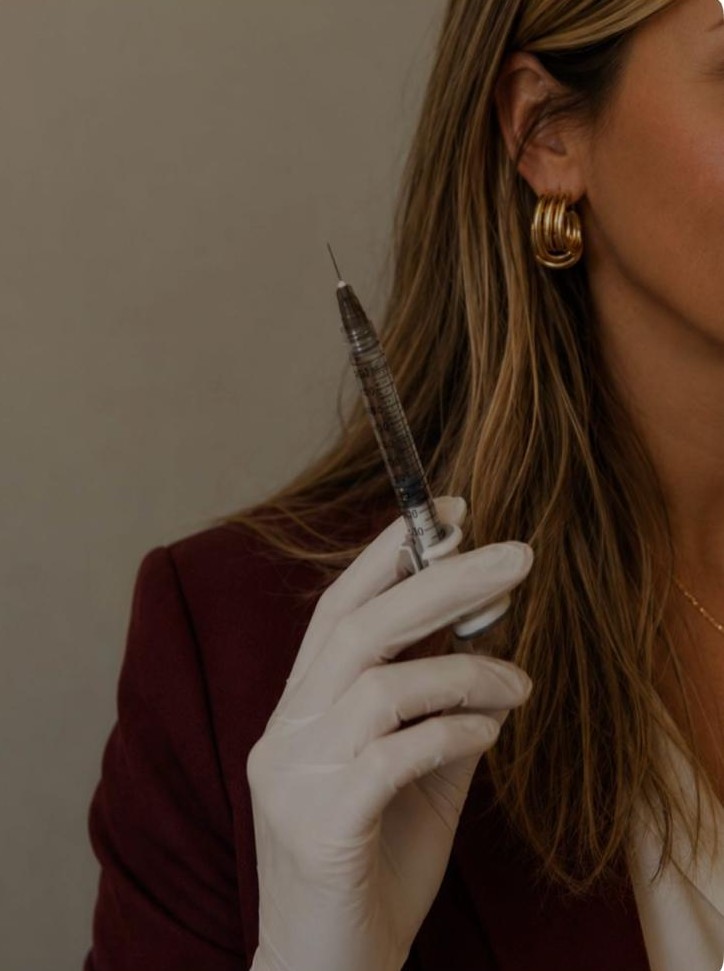 Manavie RN injector performing medical aesthetic treatment in Ottawa clinic